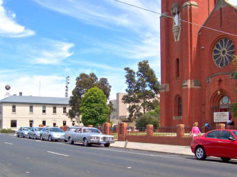 Our vehicles parked outside St Mary’s  church, Bairnsdale during a service in 2004.