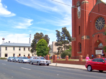 Our vehicles parked outside St Mary’s  church, Bairnsdale during a service in 2004.